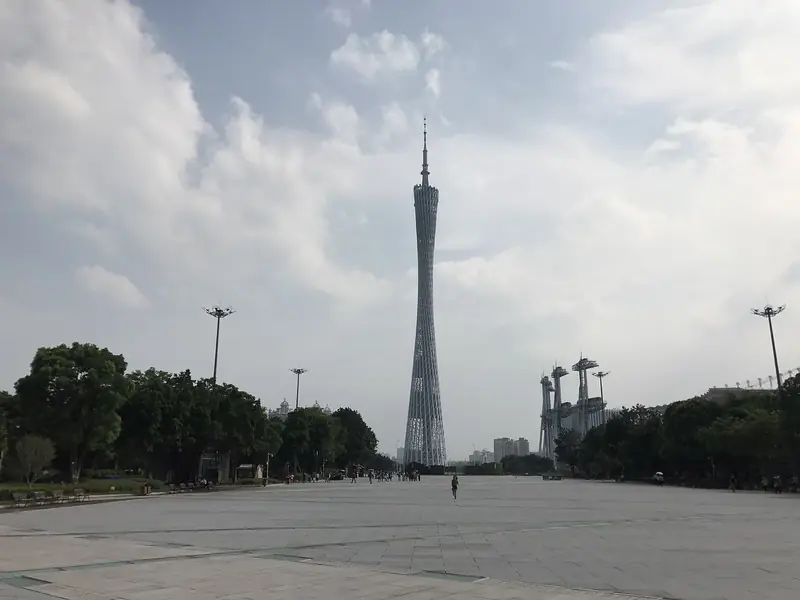 The Canton Tower lit at night above the Pearl River in Guangzhou
