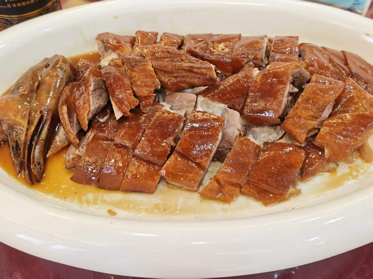 Cantonese roast meats hanging in a Guangzhou shop window